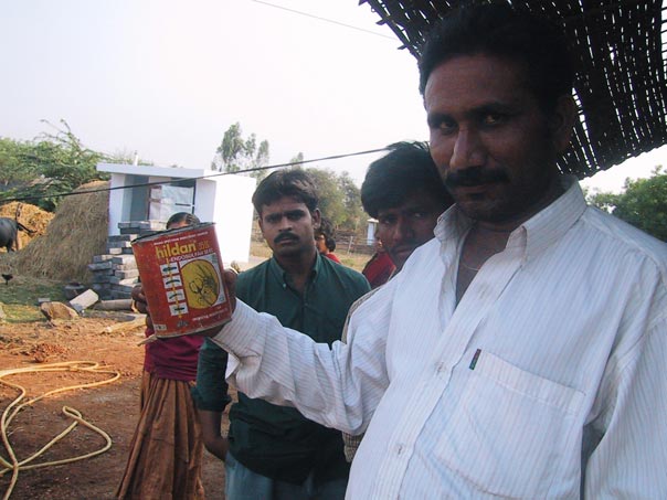 An old insecticide can used to dip water out of the well at a teashop in a village that used pesticides.