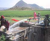 Villagers at water pump